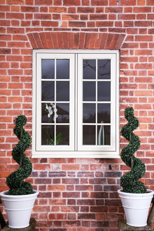 Clotted cream Residence 9 window in brick house